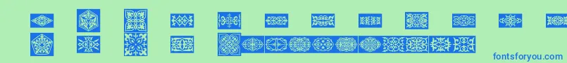 Prtornament4-fontti – siniset fontit vihreällä taustalla