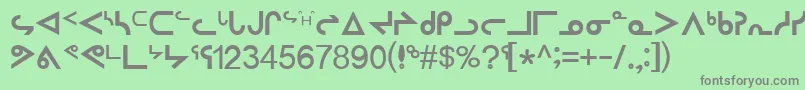 InuktitutSriRegular-fontti – harmaat kirjasimet vihreällä taustalla