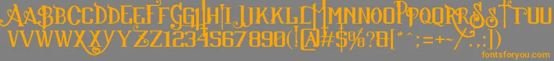 フォントSuckerFont2013JuanCasco – オレンジの文字は灰色の背景にあります。