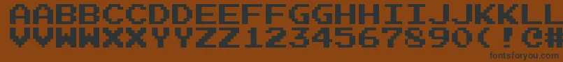 Emulogic Font – Black Fonts on Brown Background