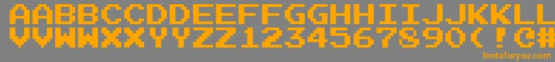 フォントEmulogic – オレンジの文字は灰色の背景にあります。