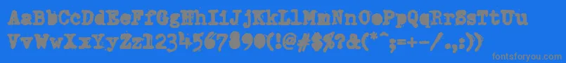 DumboldtypewriterAlternateheavy-Schriftart – Graue Schriften auf blauem Hintergrund