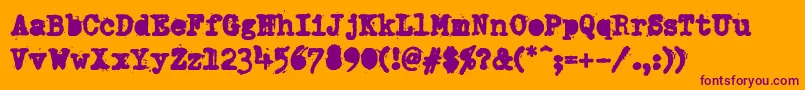DumboldtypewriterAlternateheavy-fontti – violetit fontit oranssilla taustalla