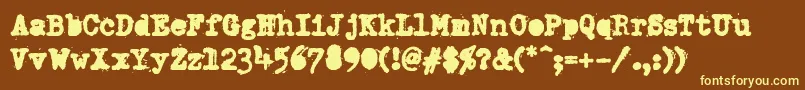 DumboldtypewriterAlternateheavy-fontti – keltaiset fontit ruskealla taustalla