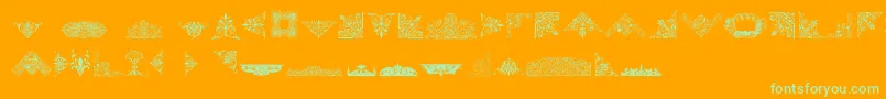 VictorianFreeOrnaments-Schriftart – Grüne Schriften auf orangefarbenem Hintergrund