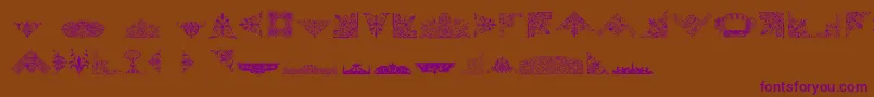 Czcionka VictorianFreeOrnaments – fioletowe czcionki na brązowym tle