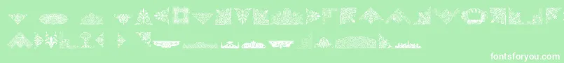 Czcionka VictorianFreeOrnaments – białe czcionki na zielonym tle