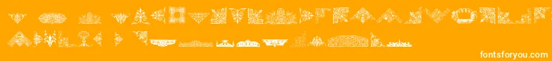 Fonte VictorianFreeOrnaments – fontes brancas em um fundo laranja