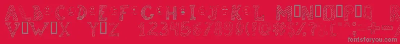 Fonte Brokenchalk – fontes cinzas em um fundo vermelho