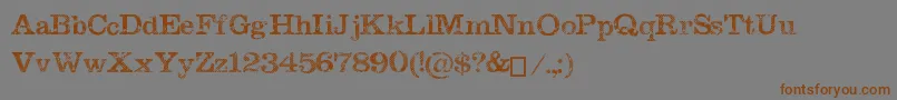 MegeonGrunge-Schriftart – Braune Schriften auf grauem Hintergrund