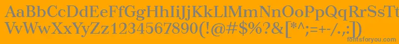 Tusartext-fontti – harmaat kirjasimet oranssilla taustalla