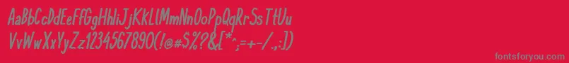 フォントKomixconBoldItalic – 赤い背景に灰色の文字