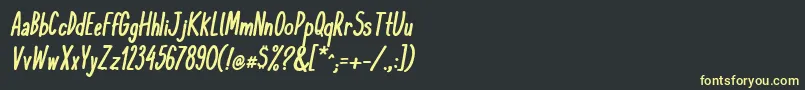 フォントKomixconBoldItalic – 黒い背景に黄色の文字