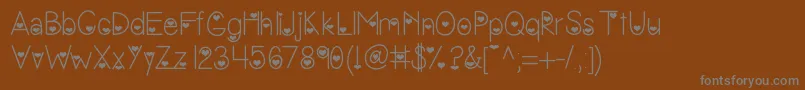 Vanessasvalentine Font – Gray Fonts on Brown Background