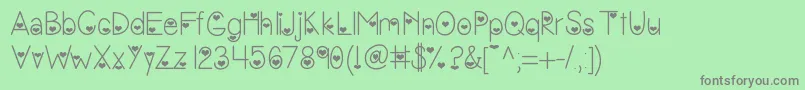 Vanessasvalentine-Schriftart – Graue Schriften auf grünem Hintergrund