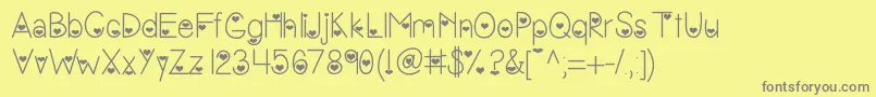 フォントVanessasvalentine – 黄色の背景に灰色の文字