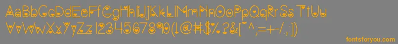 フォントVanessasvalentine – オレンジの文字は灰色の背景にあります。