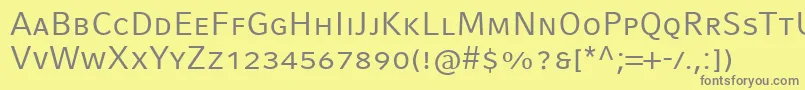 フォントCompatilFactLtComRegularSmallCaps – 黄色の背景に灰色の文字