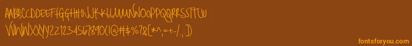 BmdBrilliant Font – Orange Fonts on Brown Background