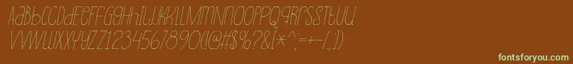 フォントSouplesseItalic – 緑色の文字が茶色の背景にあります。