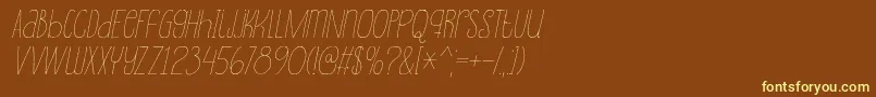 SouplesseItalic-fontti – keltaiset fontit ruskealla taustalla