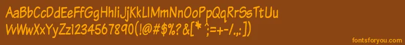 KomikaTextTight-Schriftart – Orangefarbene Schriften auf braunem Hintergrund
