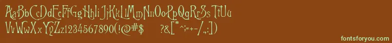 フォントRigoletto – 緑色の文字が茶色の背景にあります。