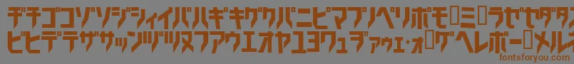 フォントTricrg – 茶色の文字が灰色の背景にあります。