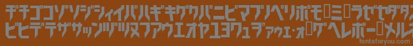 フォントTricrg – 茶色の背景に灰色の文字