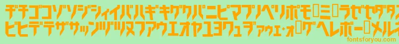 フォントTricrg – オレンジの文字が緑の背景にあります。