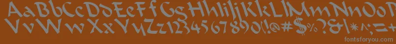 BeanieLeftyCasual-fontti – harmaat kirjasimet ruskealla taustalla
