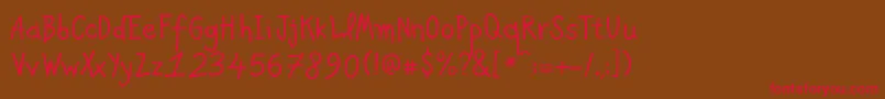 フォントPfkidsAgeten – 赤い文字が茶色の背景にあります。