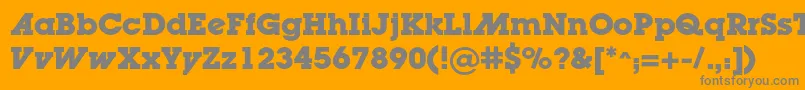 LugaadcBold-fontti – harmaat kirjasimet oranssilla taustalla