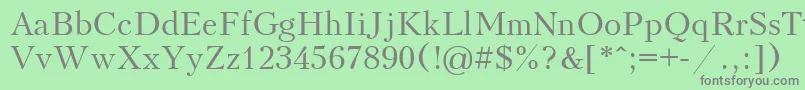 フォントUkrainiankudriashov – 緑の背景に灰色の文字