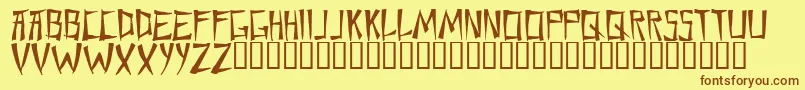 フォントChane – 茶色の文字が黄色の背景にあります。
