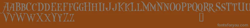 Captkd Font – Gray Fonts on Brown Background