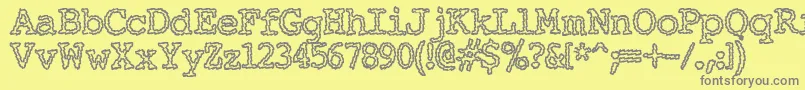 フォントElechac ffy – 黄色の背景に灰色の文字