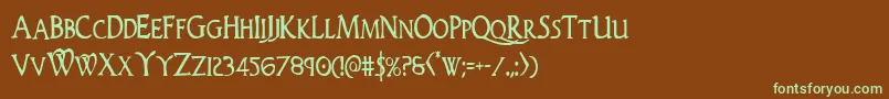 フォントWoodgodcond – 緑色の文字が茶色の背景にあります。