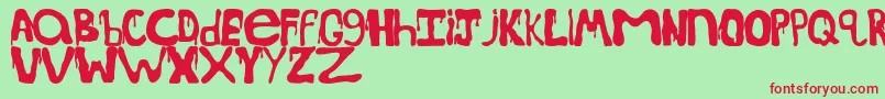 SpoookydripsRegular-Schriftart – Rote Schriften auf grünem Hintergrund