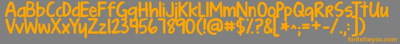 フォントKgturningtables – オレンジの文字は灰色の背景にあります。