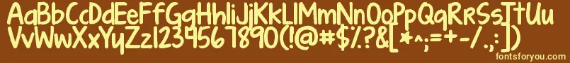 Kgturningtables-fontti – keltaiset fontit ruskealla taustalla