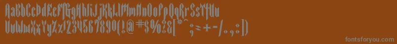 Sarcophagus2-Schriftart – Graue Schriften auf braunem Hintergrund