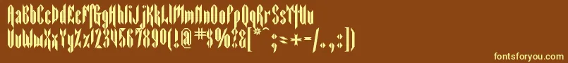 Sarcophagus2-Schriftart – Gelbe Schriften auf braunem Hintergrund