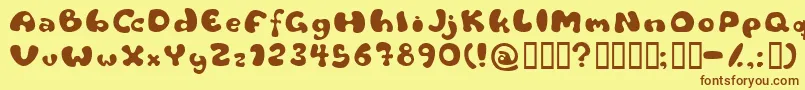 フォントFlattyre – 茶色の文字が黄色の背景にあります。