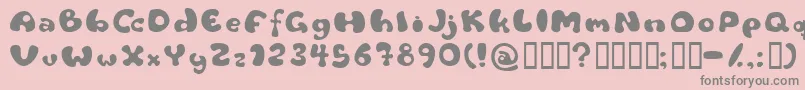 Flattyre-fontti – harmaat kirjasimet vaaleanpunaisella taustalla