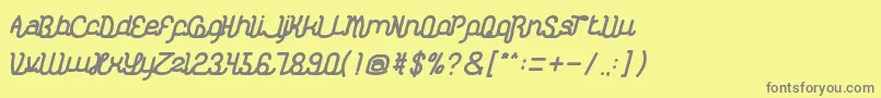 フォントKasihDanSayangBold – 黄色の背景に灰色の文字