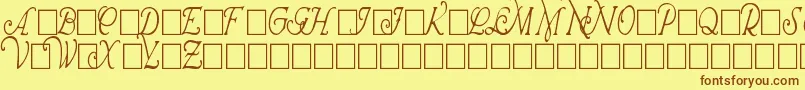 WrennInitialsCondensed-fontti – ruskeat fontit keltaisella taustalla