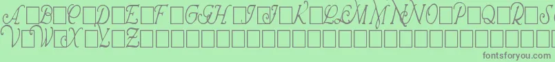 WrennInitialsCondensed-fontti – harmaat kirjasimet vihreällä taustalla