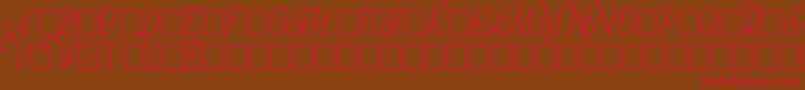 フォントWrennInitialsCondensed – 赤い文字が茶色の背景にあります。