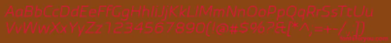 フォントAutobahnProItalic – 赤い文字が茶色の背景にあります。